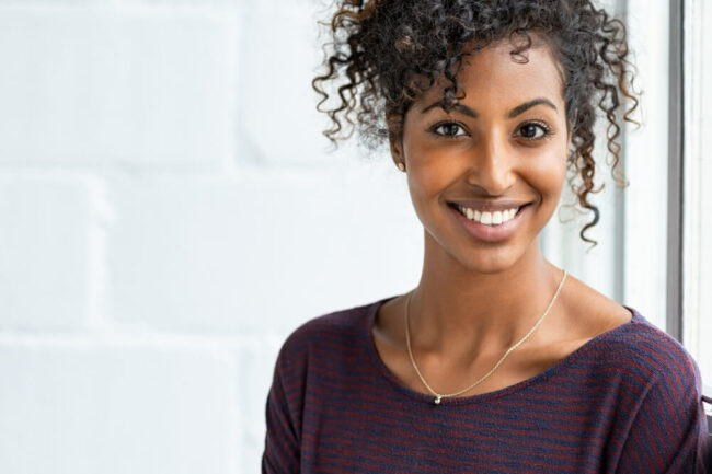 Young woman smiling with hair up