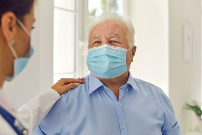 Patient and doctor wearing masks