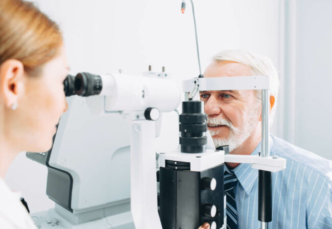 Patient getting eyes tested.