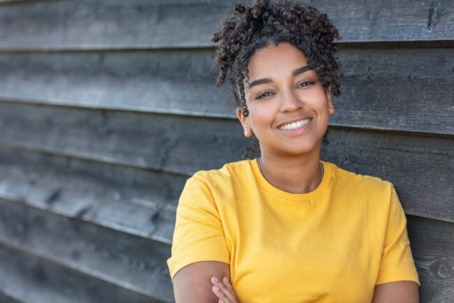 Teenage girl in yellow shirt